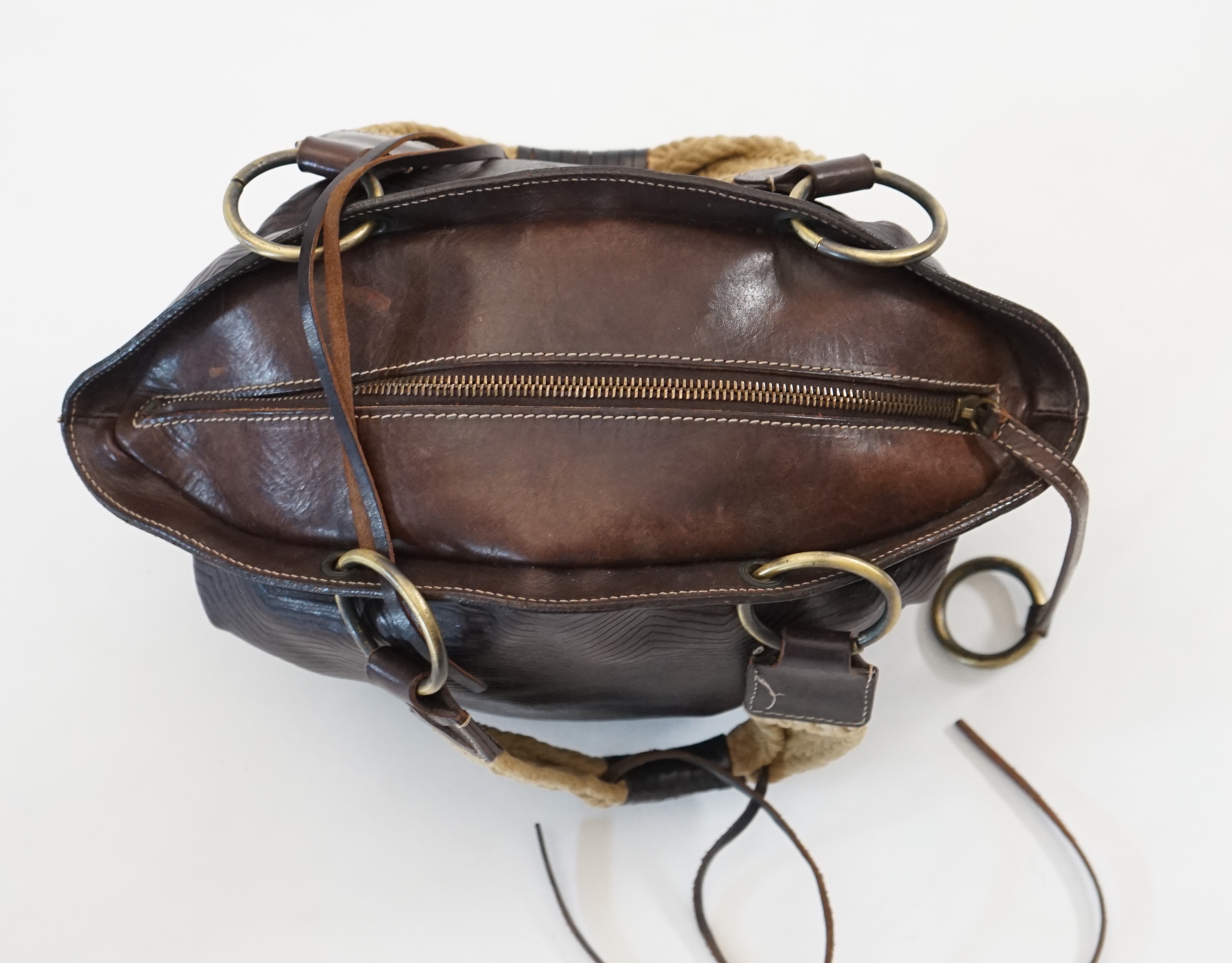 A Dolce & Gabbana brown and black leather bucket bag, width (max) 34cm, depth 14cm, height 20cm
